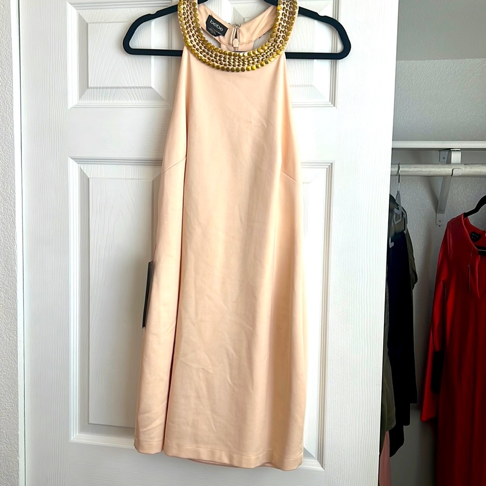 Bebe dress never been worn tight fitted very sexy open back.